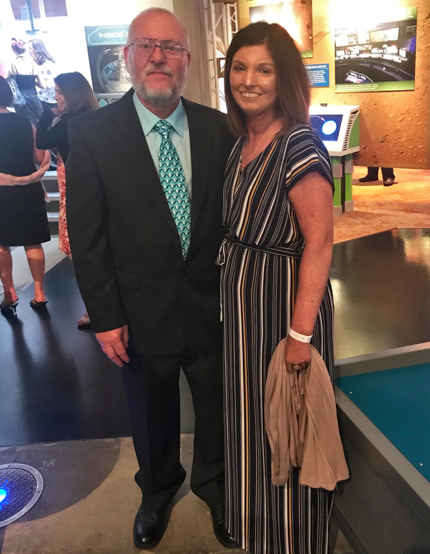 Amy with her dad and caregiver, John, at a speaking engagement in Houston with NORD