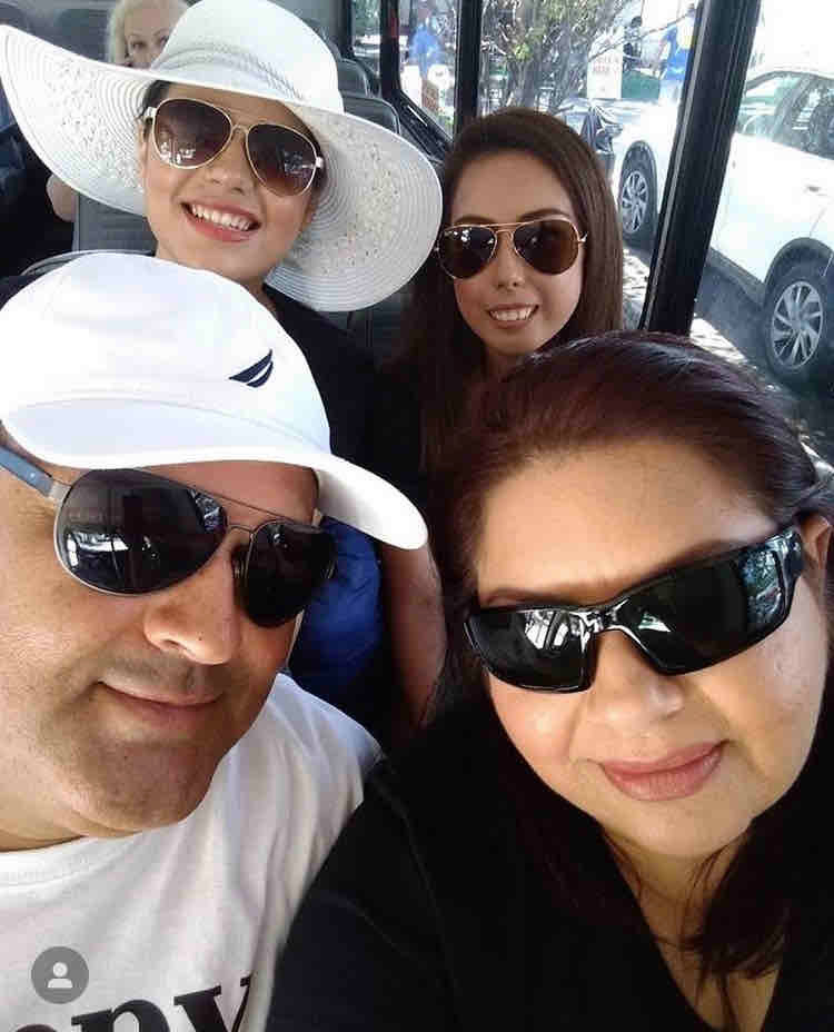 Kimberly with her sister and parents