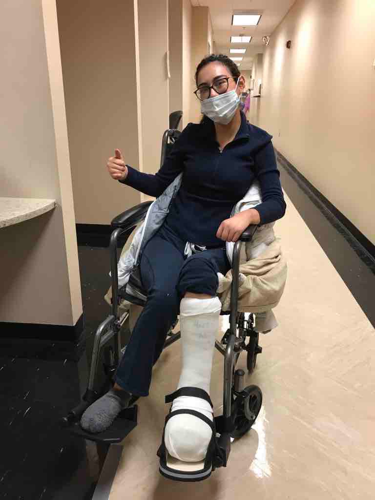 Kimberly in a wheelchair and cast because of a scleroderma-related wound on her foot