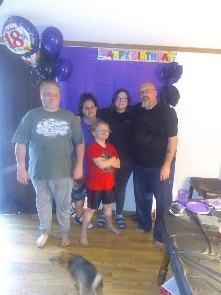 Macy with her mom, dad, and two of her three younger brothers celebrating her 18th birthday