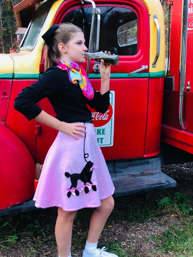 Jessie posing for a 50's and 60's-themed photoshoot with her family