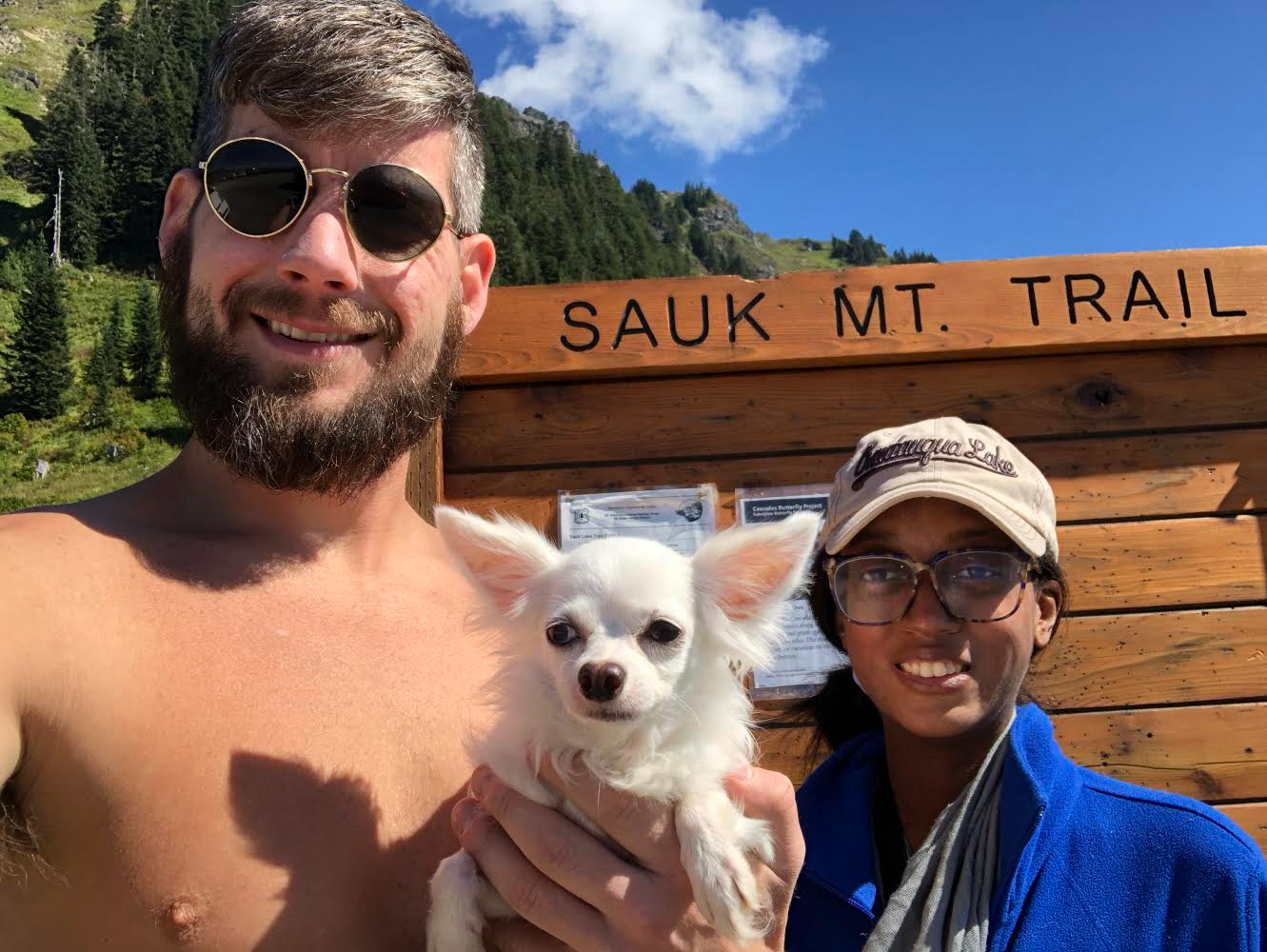 Raele, her boyfriend (Devin), and his late dog (Teko) at the trailhead for Sauk Mountain in Washington in August of 2018. This was Raele's first time hiking a mountain, and she did so a year and a half after being diagnosed with pulmonary hypertension.