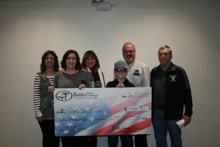 A photo from when the Wyatt the Warrior Foundation received a grant to help other families