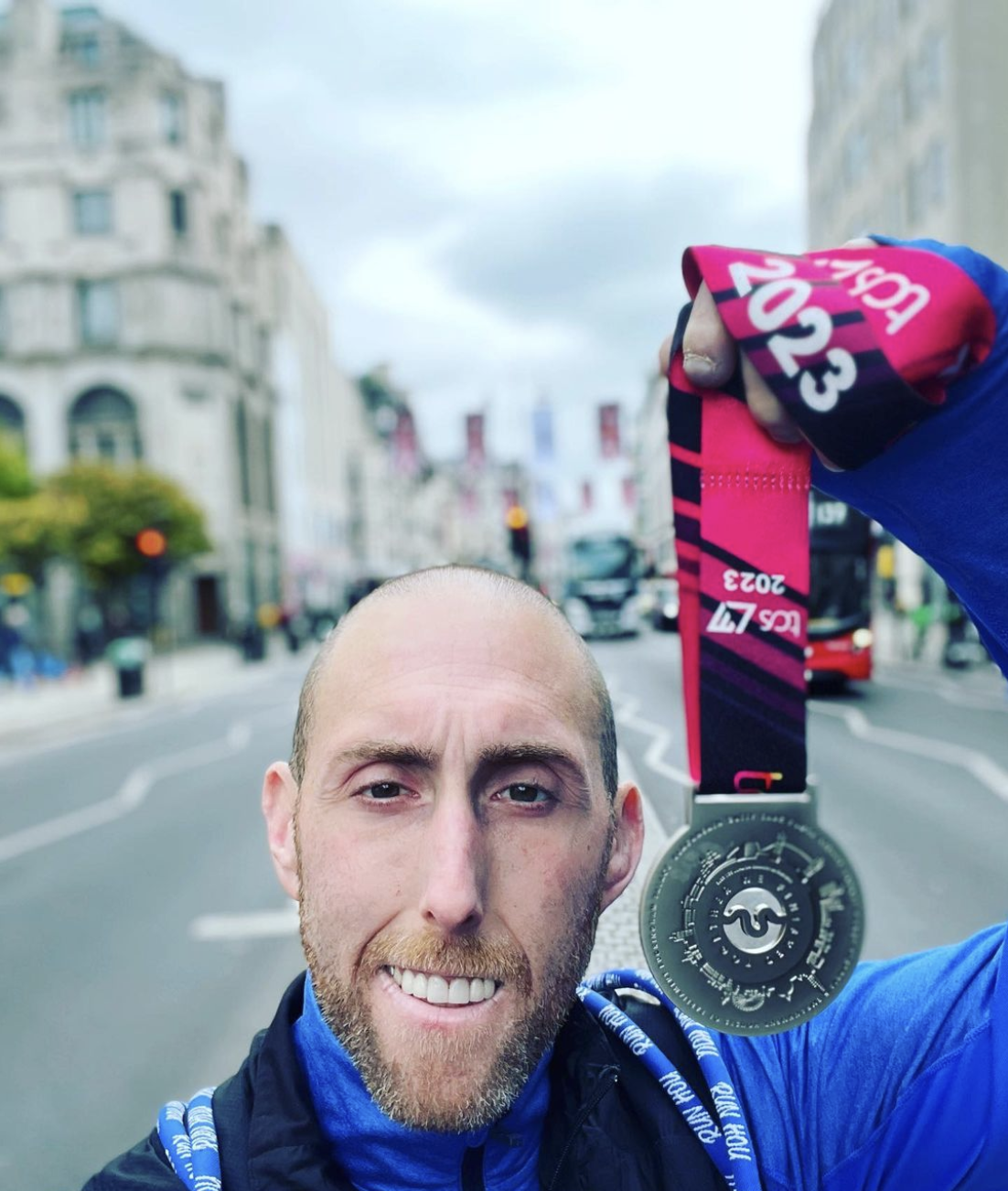 Greg with his medal from the London marathon – his 8th full marathon!