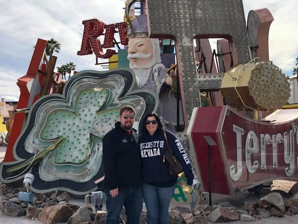 Elaine and her husband visiting the Neon Boneyard in Las Vegas