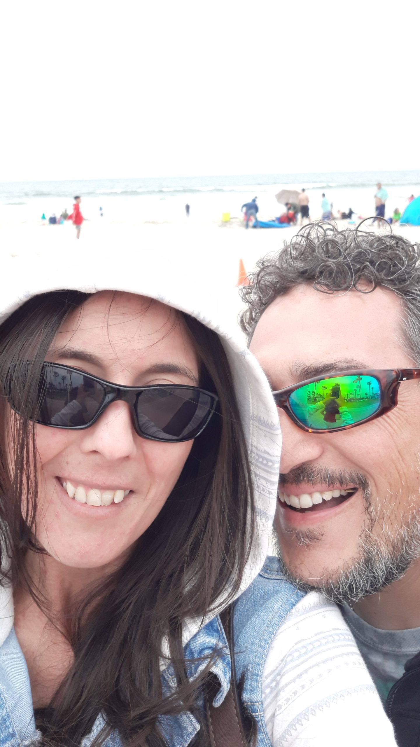 Emily and her husband visiting Mission Beach in San Diego